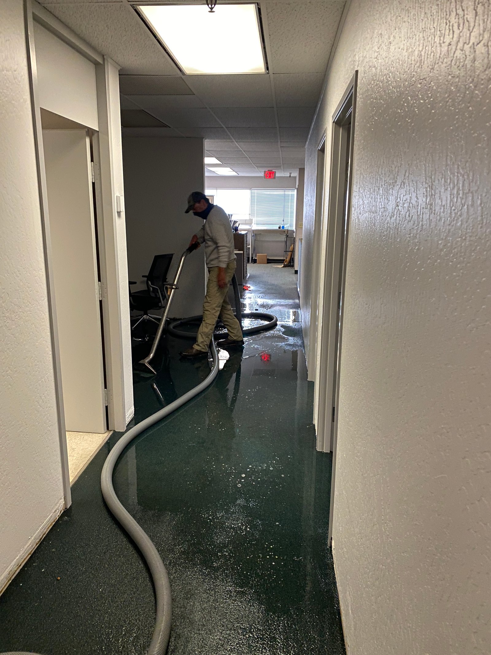 Emergency water extraction equipment removing standing water in Fresno home